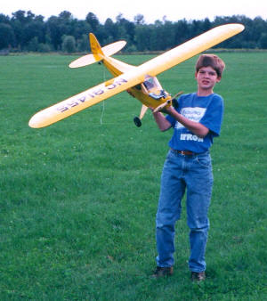 Philip Blattenberger holding my Great Planes J-3 Cub 20 (1996, Syracuse, New York) - Airplanes and Rockets