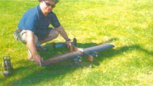 Joe Maxwell holds George Town's neat Twin-Engine Stunter (Bean Hill Flyers) - Airplanes and Rockets