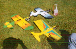 Some of Denny Thomas' colorful planes, Bean Hill Flyers November/December 2013 Newsletter - Airplanes and Rockets