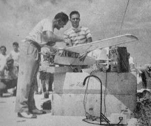 Jim Walker gives his Radio Control model a final check before a flight, November 1946 Air Trails - Airplanes & Rockets