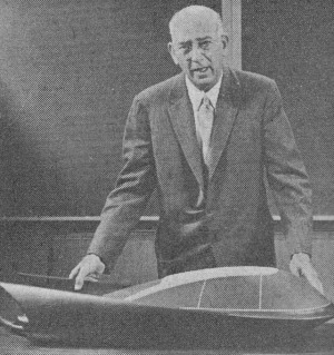 Dr. Kucher with model of Ford's "Glideair" which moves above ground via Levapads - Airplanes and Rockets