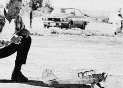 Walt Mooney on FF (Scale) - Salt Lake City's veteran scaler Noal Hess watches his Taylorcraft lift off for a winning flight. - January 1974 AAM