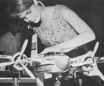 Cathy Burnstine checks the details on her B·26 Invader - Airplanes and Rockets