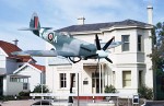 Spitfire XXII mounted in flying attitude outside Air Force Memorial House in Perth, W. Australia, W. Australia