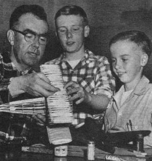 Gaffney family works on models at wintertime class - Airplanes and Rockets