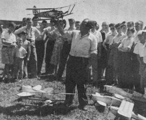 P. E. Norman, surrounded by scale free flights and usual fascinated crowd - Airplanes and Rockets