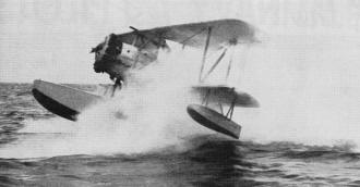 Seaplane landing in a cloud of spray in rough sea - Airplanes and Rockets
