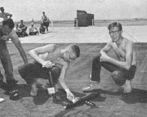 Two unidentified contestants prepare their Dynajet-powered model in the C/L jet event - Airplanes and Rockets