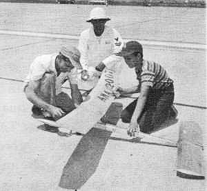 G. A. Sanderson prepares his large model for entry in the Senior Class B Free Flight Gas - Airplanes and Rockets