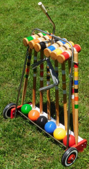 Right-rear view of restored South Bend 6-player croquet set - Airplanes and Rockets