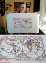Miss Mortes with her counted cross stitch "Orbis Terrae Compendiosa Descriptio" - Airplanes and Rockets