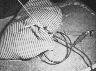 Sandbag at anchor conceals secret device for cutting anchor line electrically at launching - Airplanes and Rockets