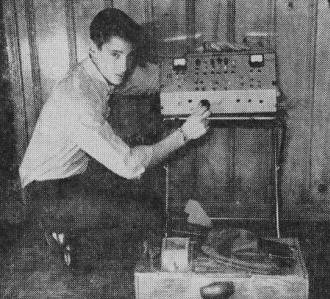 Allen Wechter poses with electronic monitor used in the highly automated launching - Airplanes and Rockets